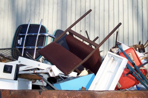 Professionals removing a sofa from a Hampstead Garden Suburb home